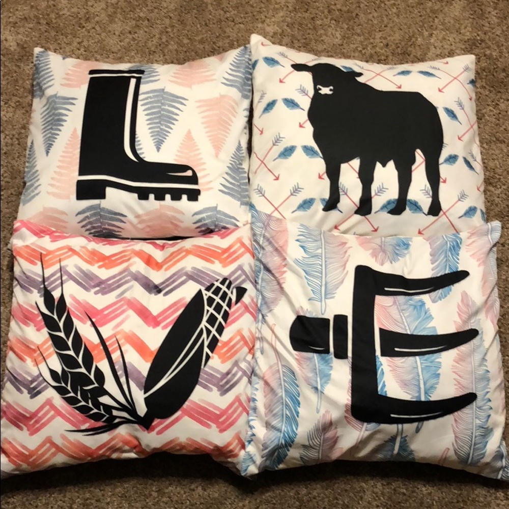 Set of 4 decorative pillows. Spell out LOVE